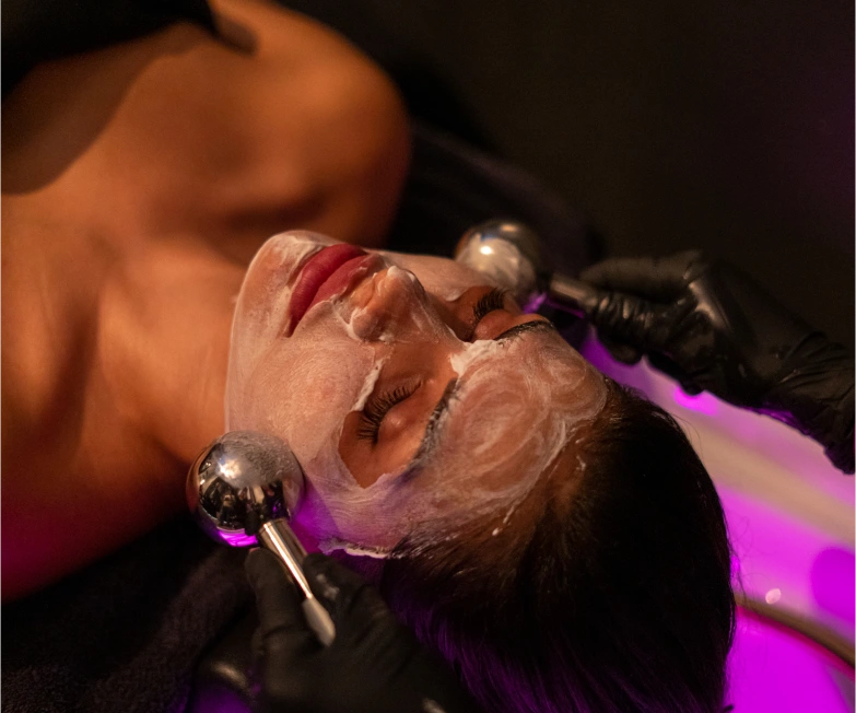 Deeply relaxed woman undergoing a scalp treatment